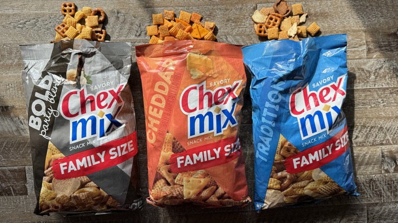 Three opened bags of Chex Mix