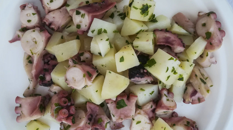 Octopus and potato salad on a plate
