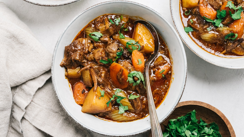 Bowls of beef stew with potatoes and carrots