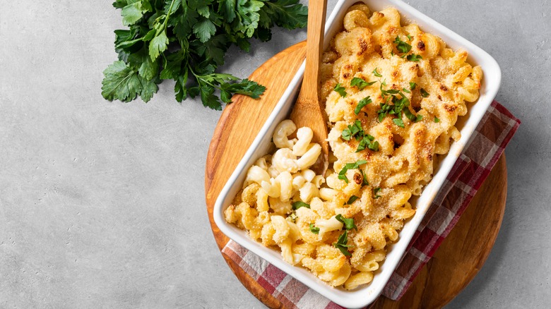 Oven dish of homemade mac and cheese with parsley