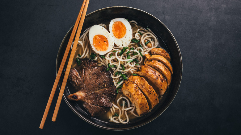 Bowl of ramen with mushrooms, chicken, and eggs