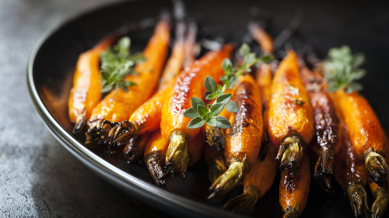 Plate of glazed and roasted carrots with thyme