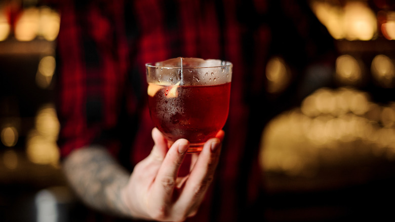 bartender holding cocktail