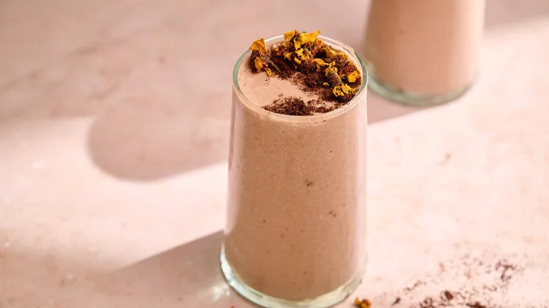 Best Coffee Smoothie in glass on pink background