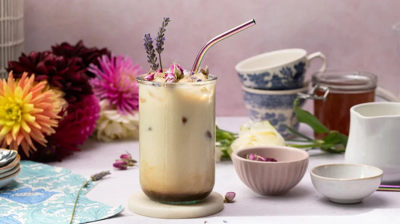 It Ends With Us "Lily Bloom Latte" in clear glass with straw and dried flowers