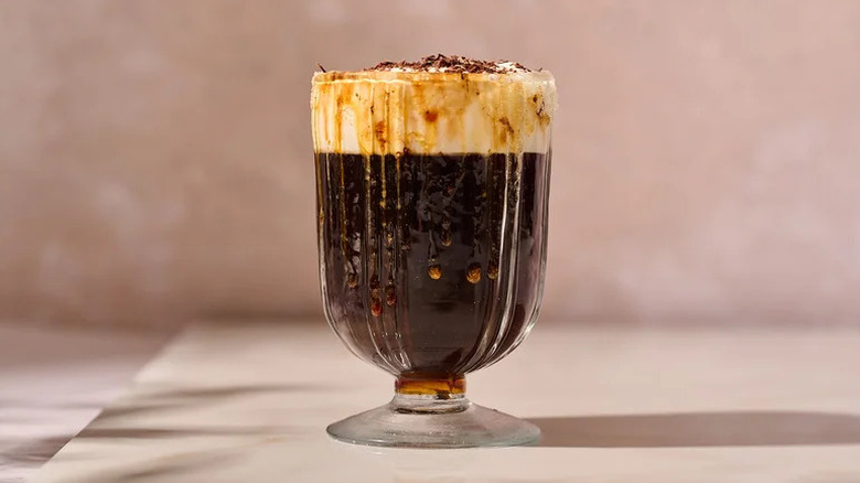 Decadent Spanish Coffee in glass on pink background