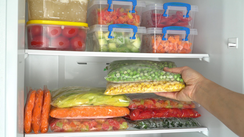 Stacks of containers in refrigerator