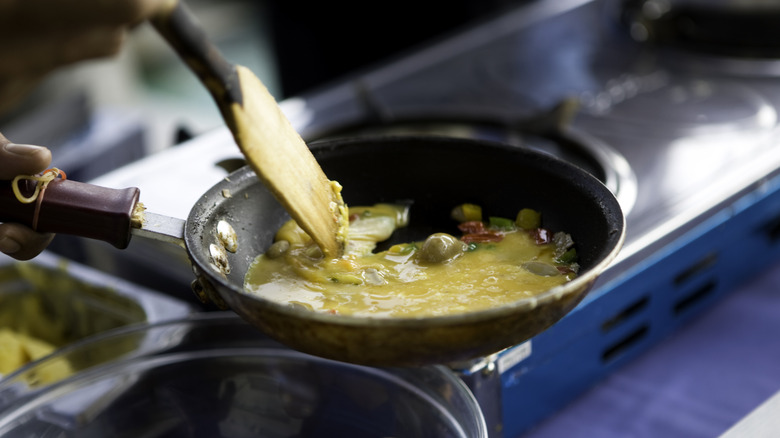 eggs and vegetables in pan