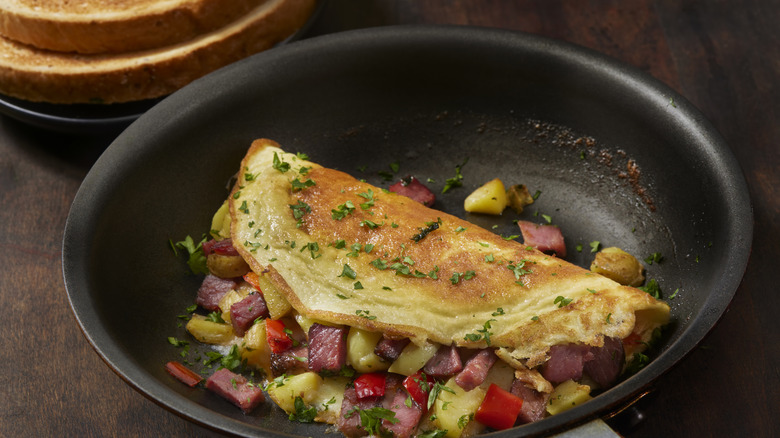 overstuffed omelet in a pan