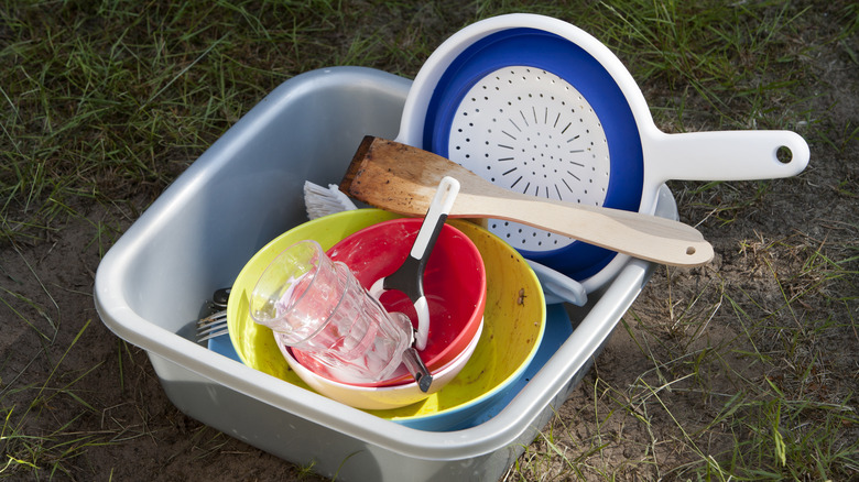 Dirty dishes in a bin