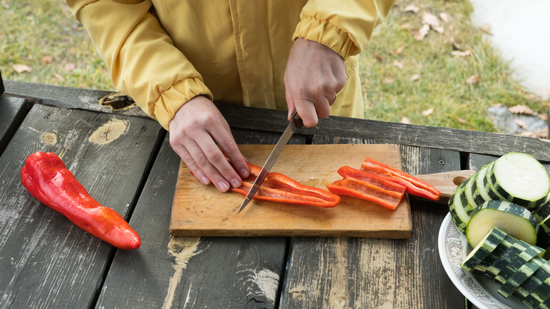 Woman slicing vegetables 