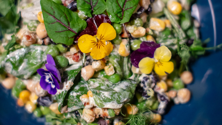 Vegetarian bowl with edible flowers