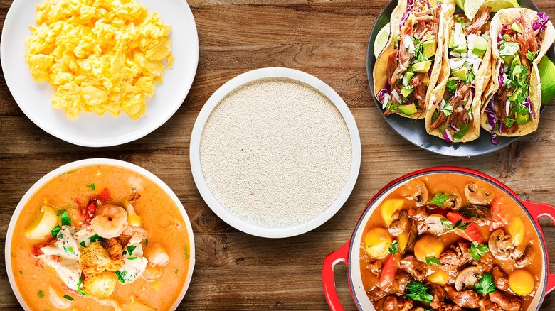 nutritional yeast with different dishes on wooden table