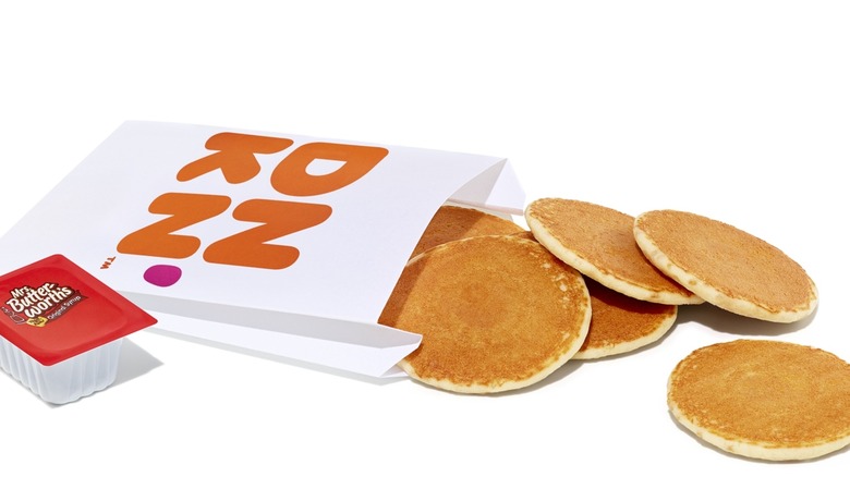 Dunkin's Pancake Minis with syrup on white background