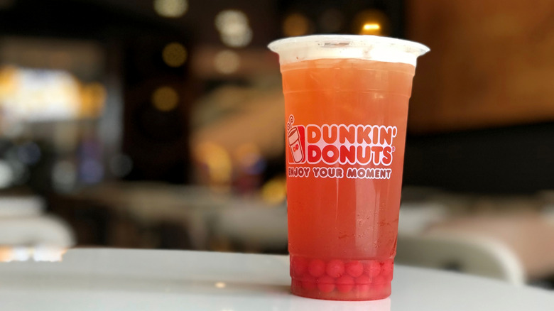 Dunkin' strawberry Popping Bubbles on a table in restaurant