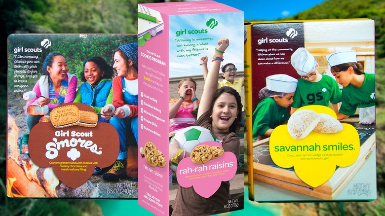 Three boxes of Girl Scout cookies on a wooden table