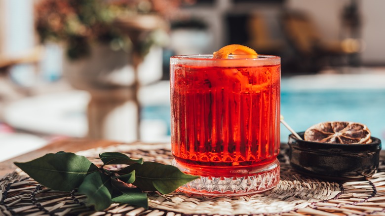 Negroni on poolside table