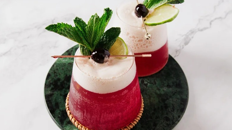 two frozen shirley temples on display with fresh mint leaves on top