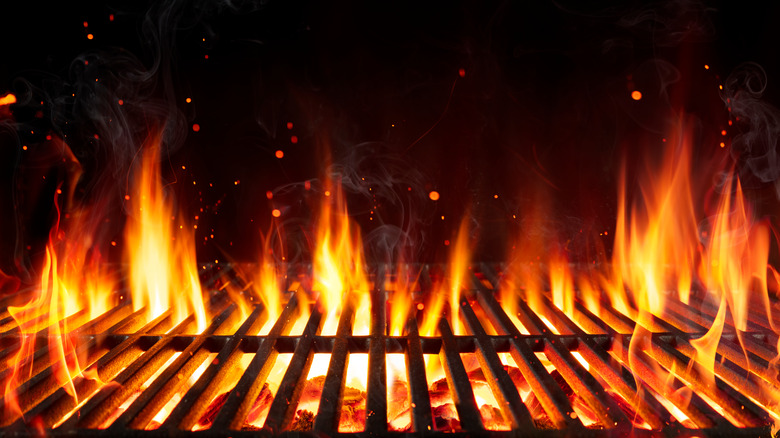 Flame over a grill grate