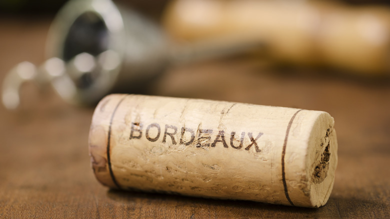 Bordeaux wine cork on table