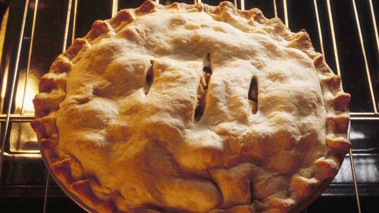 Pie baking in an oven with vents