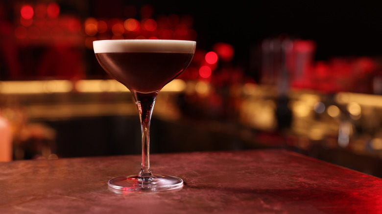 Close up of an espresso martini on a bar top