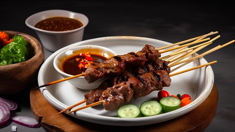 skewers of satay with cucumber