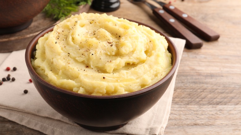 brown bowl of mashed potatoes