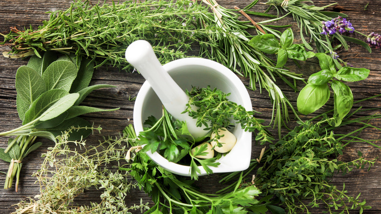 Pestle and mortar with herbs