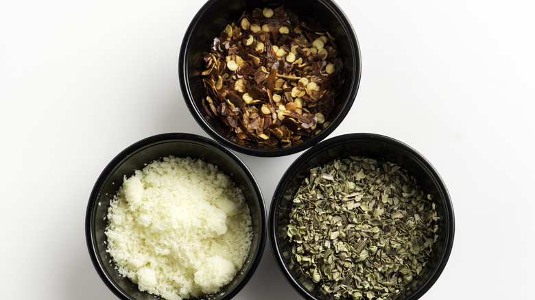 Three black bowls with spices