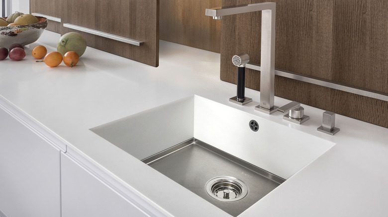 Kitchen sink and white counter