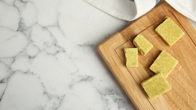 Bouillon cubes on wooden board