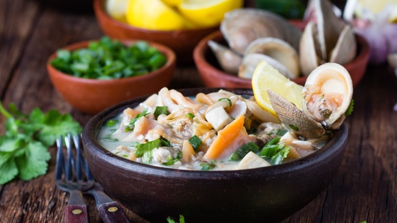 A bowl of ceviche with a fork