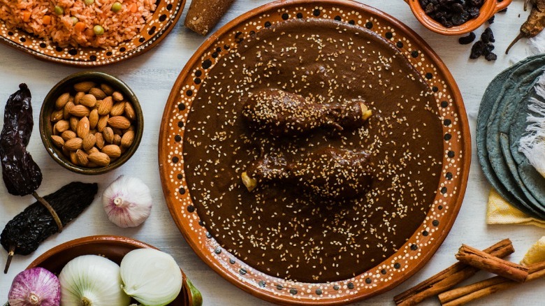 Plate of chicken mole with ingredients