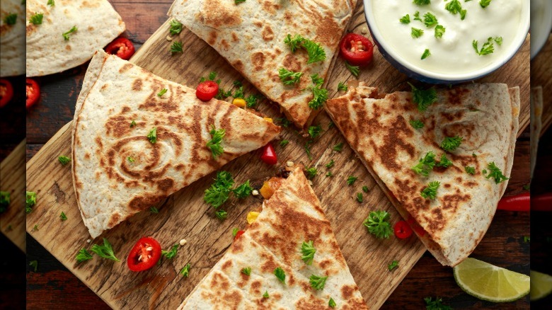 Quartered quesadilla with crema