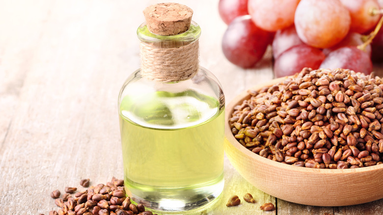 Oil bottle beside seed bowl