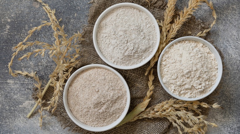 Three white bowls of flour 