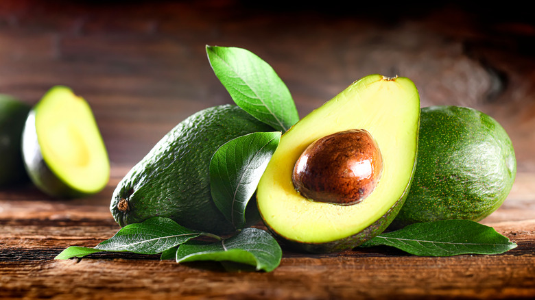 avocados on wooden board