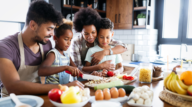 family cooking together parents kids