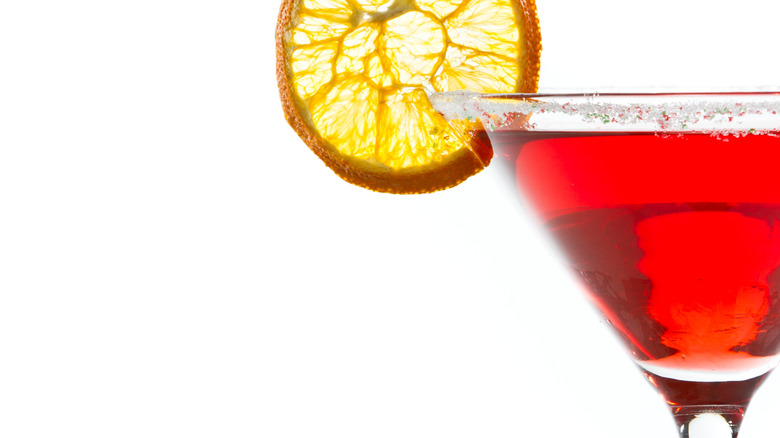 red martini with dehydrated orange