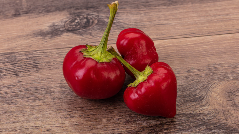 cherry peppers on wood table