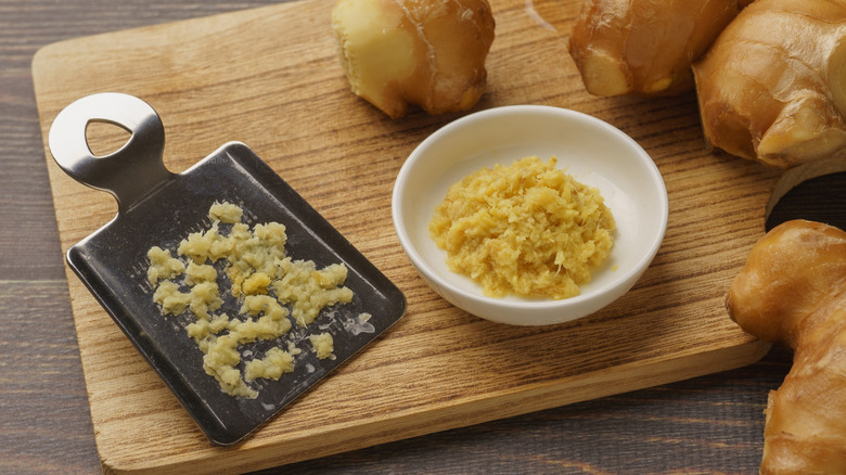 Grating ginger on cutting board