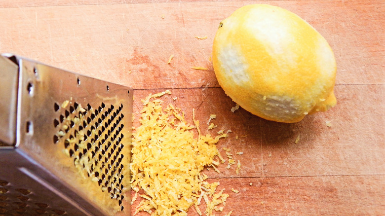 Zesting a lemon with a box grater