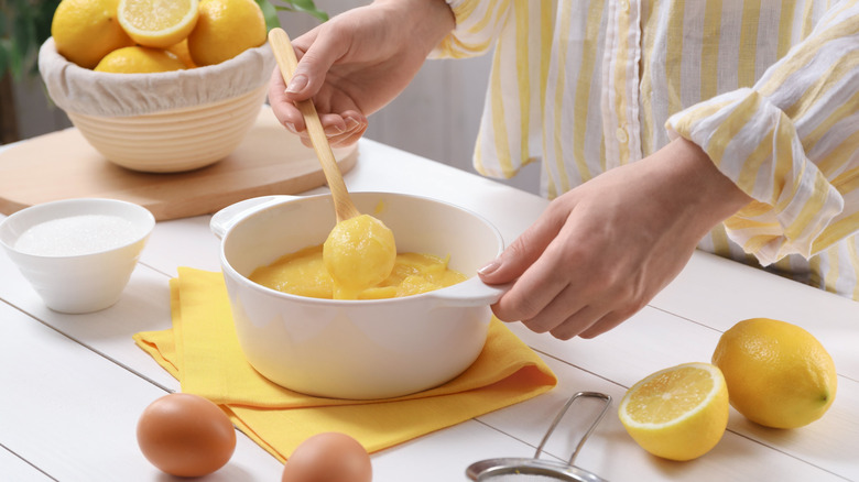 Making lemon curd in white mixing bowl