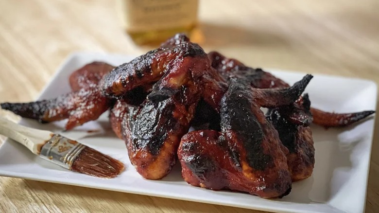 hot honey bourbon barbecue chicken wings displayed on plate