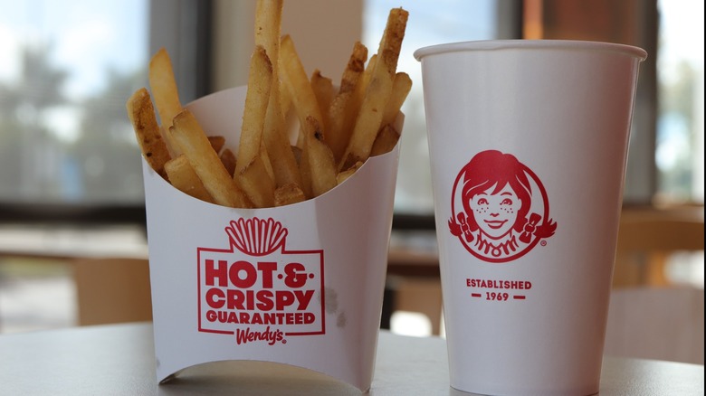 Wendy's order of french fries and Wendy's cup on the table