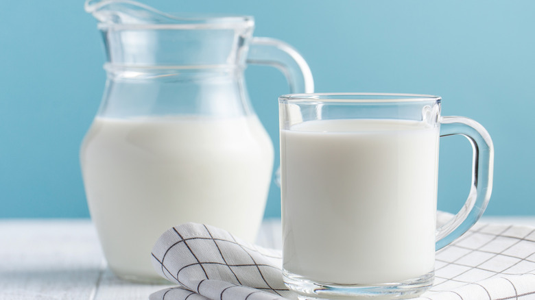 cup and pitcher of milk