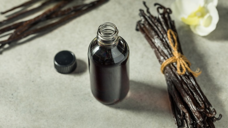 Bottle of vanilla extract with vanilla pods