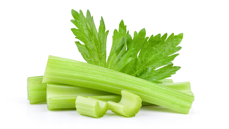 Sticks of celery on white background