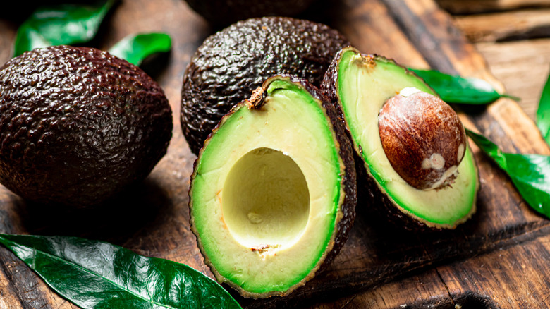 Open avocado on table